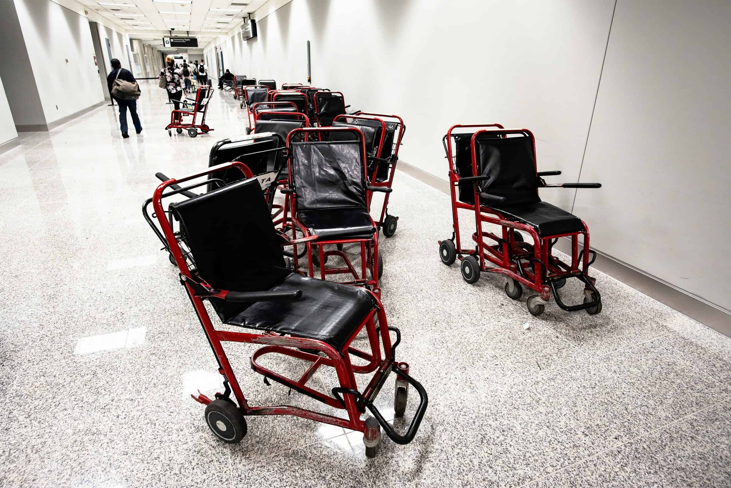 Empty wheelchairs in an airport hall.